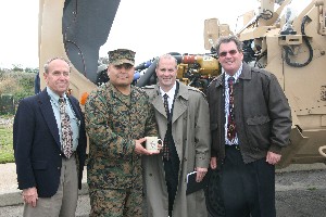 After the January meeting, Michael Murphy (l), team lead for the Joint Interoperability of Tactical Command and Control Systems (JINTACCS), Marine Corps Tactical Systems Support Activity (MCTSSA) Interoperability branch;
Chief Warrant Officer Guerrero (2nd from l); Gabriel Raia (2nd from r), chapter vice president for information technology; and Marty Paulsen, chapter vice president for education, discuss the meeting's topics and events.